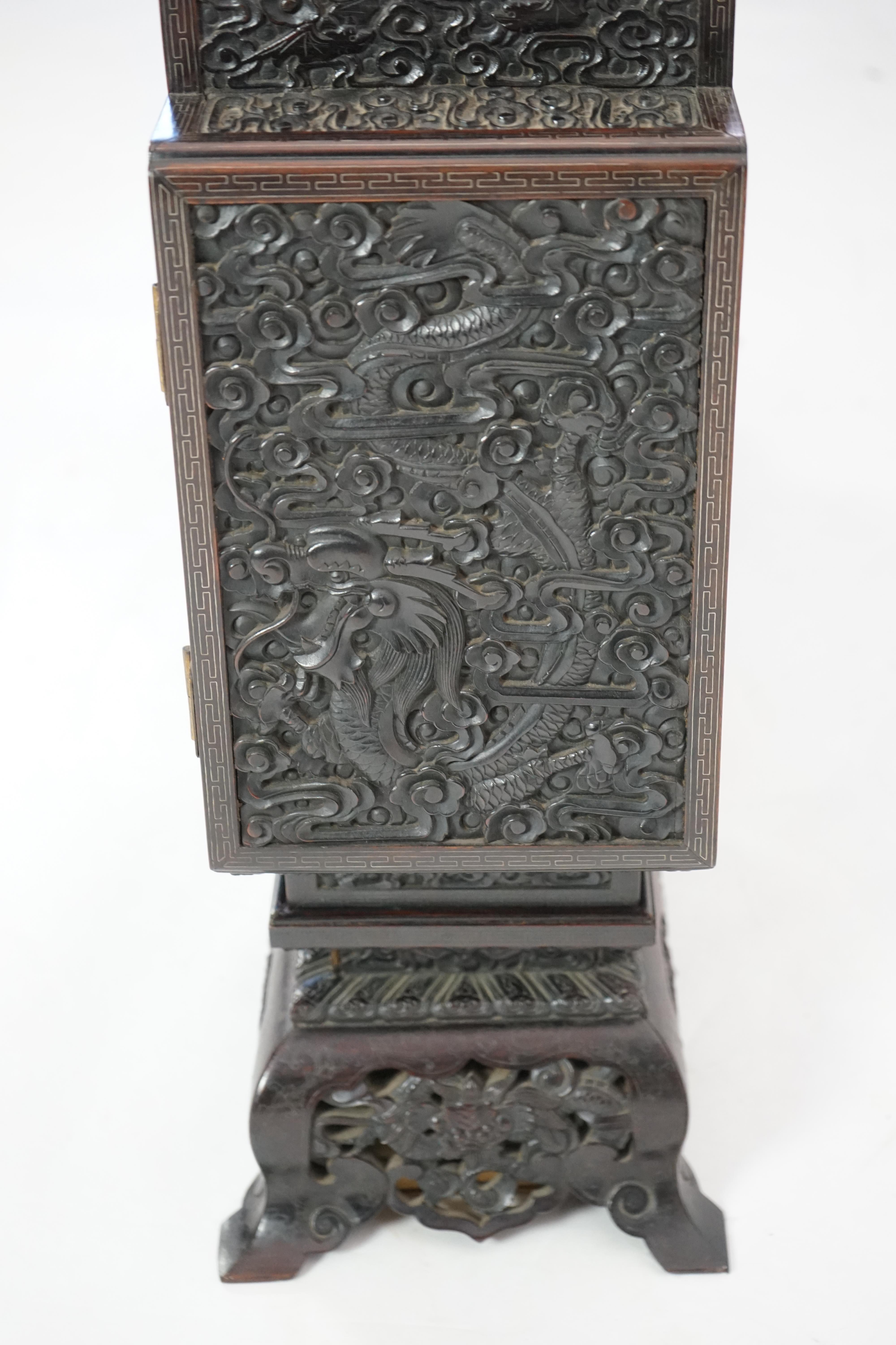 An important pair of Chinese carved zitan and silver wire inlaid ‘cloud and dragon’ curio cabinets and stands, duobaoge, probably Imperial, late Qing dynasty